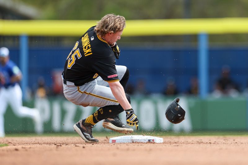 Mar 23, 2025; Dunedin, Florida, USA; Pittsburgh Pirates outfielder Jack Suwinski (65) slides into second base for a double against the Toronto Blue Jays in the second inning during spring training at TD Ballpark. Mandatory Credit: Nathan Ray Seebeck-Imagn Images