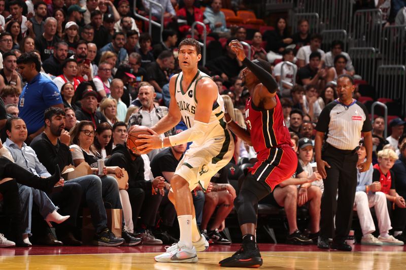 MIAMI, FL - NOVEMBER 26: Brook Lopez #11 of the Milwaukee Bucks handles the ball during the game against the Miami Heat during the Emirates NBA Cup game on November 26, 2024 at Kaseya Center in Miami, Florida. NOTE TO USER: User expressly acknowledges and agrees that, by downloading and or using this Photograph, user is consenting to the terms and conditions of the Getty Images License Agreement. Mandatory Copyright Notice: Copyright 2024 NBAE (Photo by Issac Baldizon/NBAE via Getty Images)