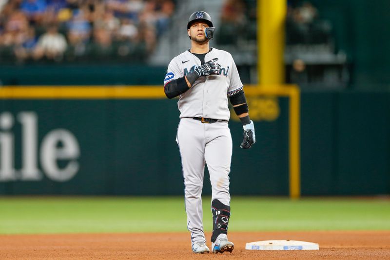 Aug 6, 2023; Arlington, Texas, USA; Miami Marlins first baseman Yuli Gurriel (10) hits a double during the seventh inning against the Texas Rangers at Globe Life Field. Mandatory Credit: Andrew Dieb-USA TODAY Sports