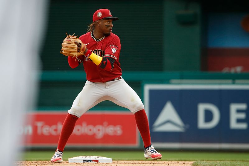 Jun 22, 2023; Washington, District of Columbia, USA; Arizona Diamondbacks shortstop Geraldo Perdomo (2) throws the ball to first for a double play in the fifth inning against the Washington Nationals at Nationals Park. Mandatory Credit: Amber Searls-USA TODAY Sports