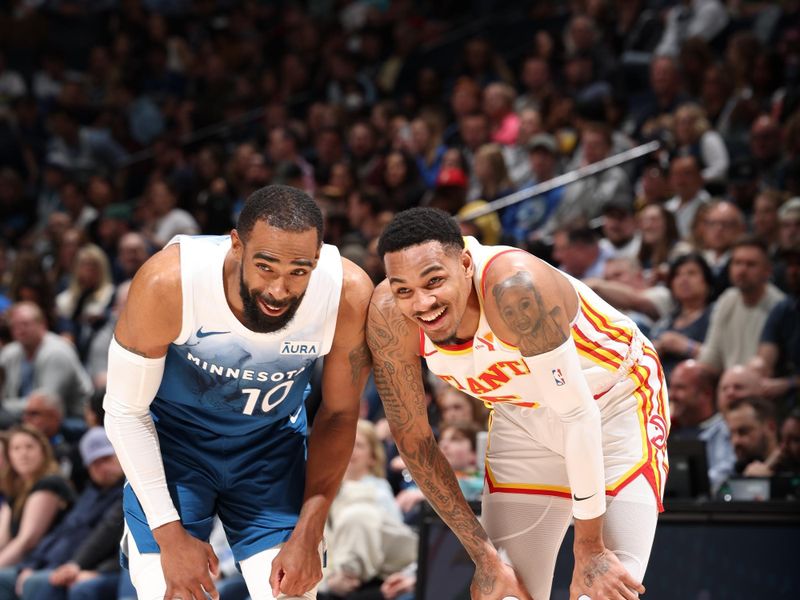 MINNEAPOLIS, MN -  APRIL 12:  Mike Conley #10 of the Minnesota Timberwolves talks to Dejounte Murray #5 of the Atlanta Hawks during the game on April 12, 2024 at Target Center in Minneapolis, Minnesota. NOTE TO USER: User expressly acknowledges and agrees that, by downloading and or using this Photograph, user is consenting to the terms and conditions of the Getty Images License Agreement. Mandatory Copyright Notice: Copyright 2024 NBAE (Photo by David Sherman/NBAE via Getty Images)