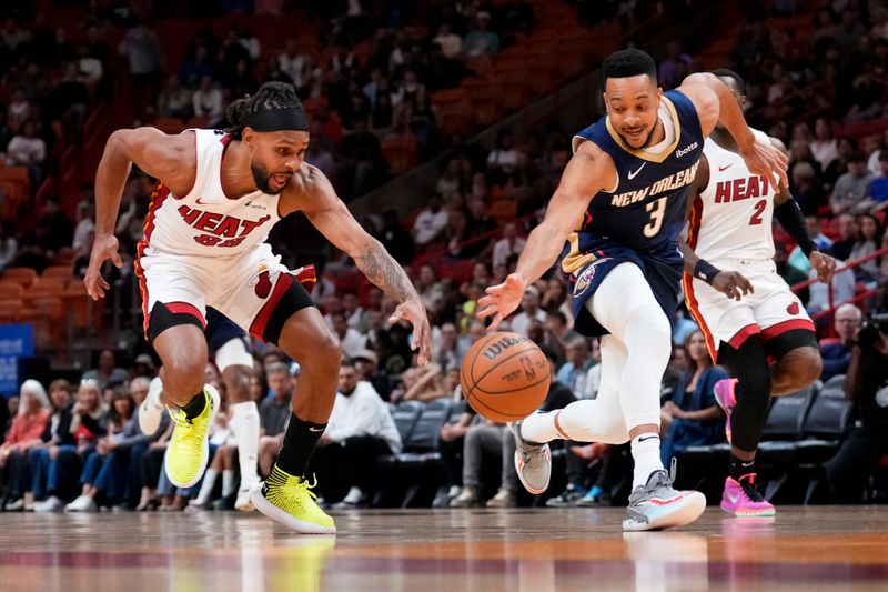 MIAMI, FLORIDA - MARCH 22: Patty Mills #88 of the Miami Heat steals the ball from CJ McCollum #3 of the New Orleans Pelicans during the first quarter at Kaseya Center on March 22, 2024 in Miami, Florida. NOTE TO USER: User expressly acknowledges and agrees that, by downloading and or using this photograph, User is consenting to the terms and conditions of the Getty Images License Agreement. (Photo by Rich Storry/Getty Images)