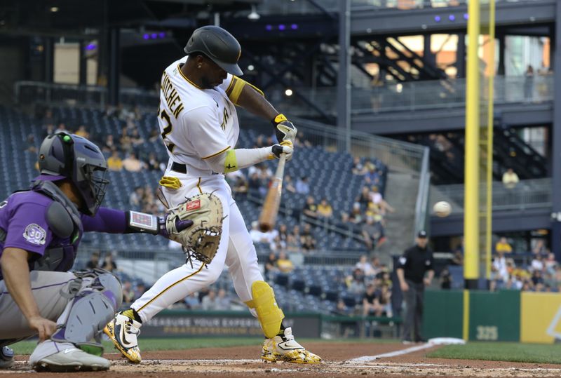 May 9, 2023; Pittsburgh, Pennsylvania, USA; Pittsburgh Pirates designated hitter Andrew McCutchen (22) hits an RBI single against the Colorado Rockies during the third inning at PNC Park. Mandatory Credit: Charles LeClaire-USA TODAY Sports