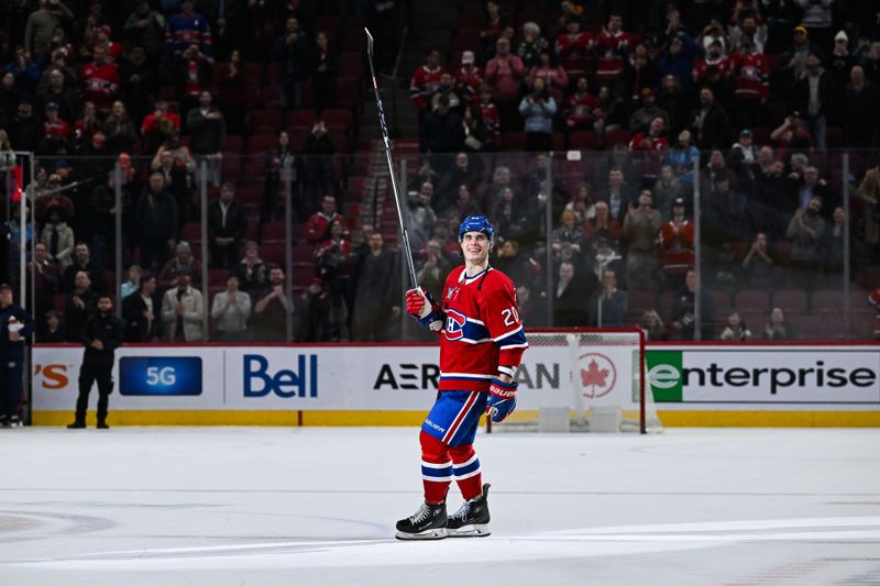 Feb 13, 2024; Montreal, Quebec, CAN; Montreal Canadiens left wing Juraj Slafkovsky (20) second star of the game salutes the crowd after the win against the Anaheim Ducks at Bell Centre. Mandatory Credit: David Kirouac-USA TODAY Sports