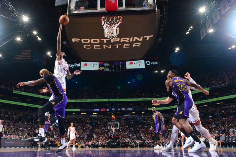 PHOENIX, AZ - OCTOBER 28: Kevin Durant #35 of the Phoenix Suns drives to the basket during the game against the Los Angeles Lakers on October 28, 2024 at Footprint Center in Phoenix, Arizona. NOTE TO USER: User expressly acknowledges and agrees that, by downloading and or using this photograph, user is consenting to the terms and conditions of the Getty Images License Agreement. Mandatory Copyright Notice: Copyright 2024 NBAE (Photo by Kate Frese/NBAE via Getty Images)