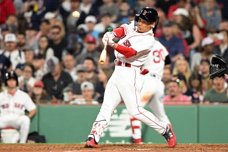 May 31, 2023; Boston, Massachusetts, USA; Boston Red Sox left fielder Masataka Yoshida (7) hits a double against the Cincinnati Reds during the eighth inning at Fenway Park. Mandatory Credit: Brian Fluharty-USA TODAY Sports