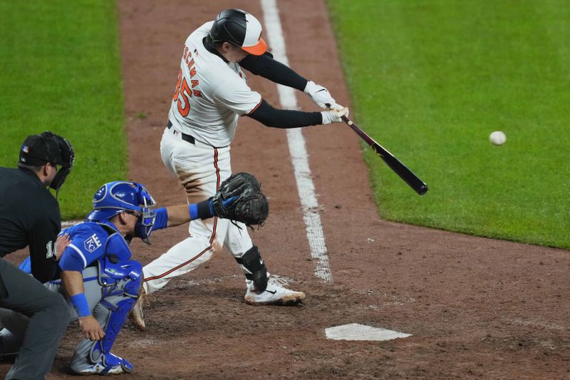 Apr 3, 2024; Baltimore, Maryland, USA; Baltimore Orioles designated hitter Adley Rutschman (35) drives in a run during the eighth inning against the Kansas City Royals at Oriole Park at Camden Yards. Mandatory Credit: Mitch Stringer-USA TODAY Sports
