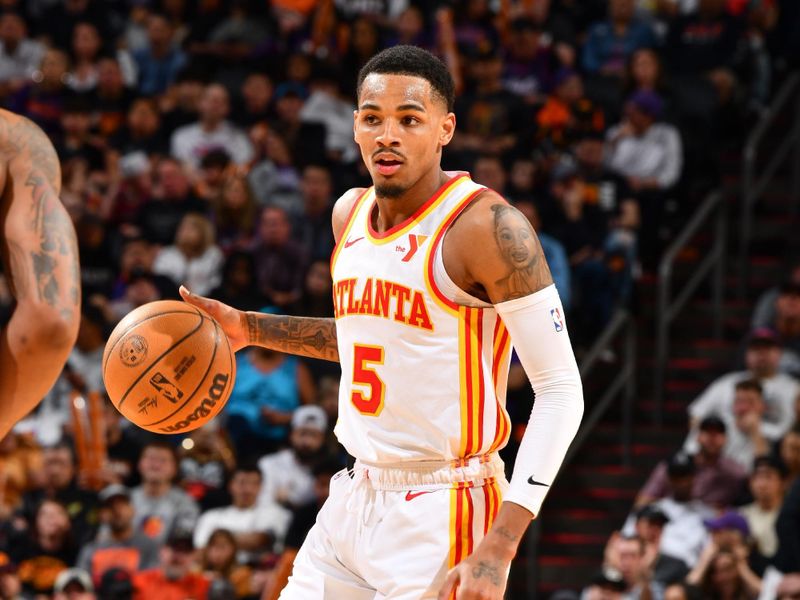 PHOENIX, AZ - MARCH 21:  Dejounte Murray #5 of the Atlanta Hawks handles the ball during the game  on March 21, 2024 at Footprint Center in Phoenix, Arizona. NOTE TO USER: User expressly acknowledges and agrees that, by downloading and or using this photograph, user is consenting to the terms and conditions of the Getty Images License Agreement. Mandatory Copyright Notice: Copyright 2024 NBAE (Photo by Barry Gossage/NBAE via Getty Images)