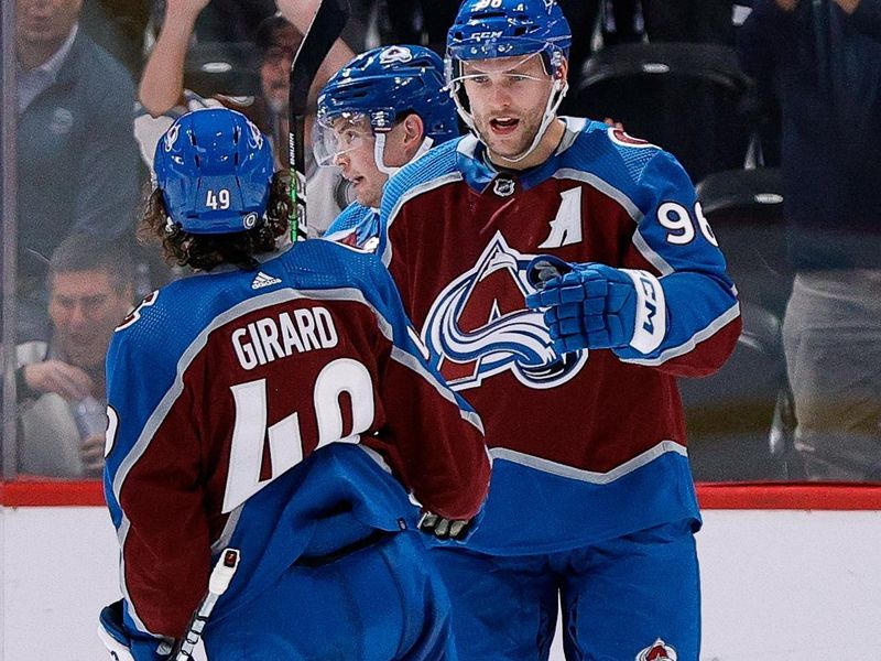 Oct 5, 2022; Denver, Colorado, USA; Colorado Avalanche right wing Mikko Rantanen (96) celebrates his goal with defenseman Samuel Girard (49) in the third period against the Dallas Stars at Ball Arena. Mandatory Credit: Isaiah J. Downing-USA TODAY Sports