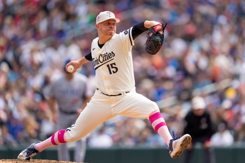 May 14, 2023; Minneapolis, Minnesota, USA; Minnesota Twins relief pitcher Emilio Pagan (15) pitches in relief against the Chicago Cubs in the seventh inning at Target Field. Mandatory Credit: Matt Blewett-USA TODAY Sports