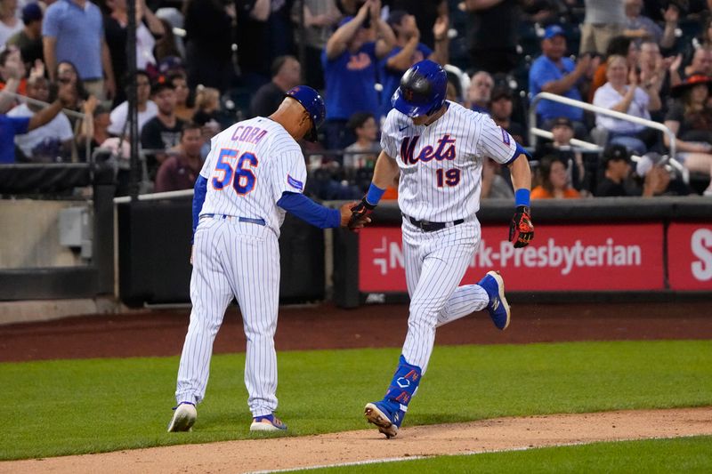 Jul 2, 2023; New York City, New York, USA; New York Mets third base coach Joey Cora (56) congratulates New York Mets Mark Canha (19) for hitting a home run against the San Francisco Giants during the fourth inning at Citi Field. Mandatory Credit: Gregory Fisher-USA TODAY Sports