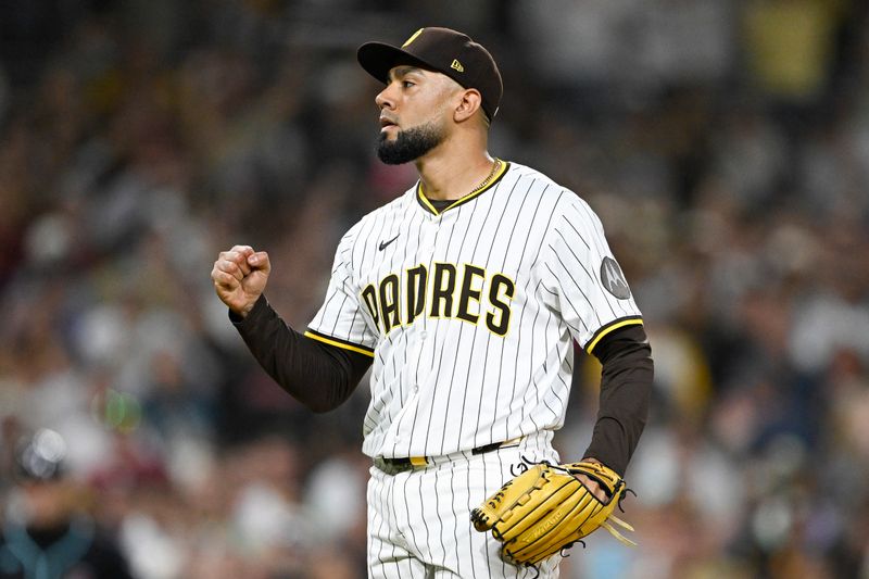 Sep 27, 2025; San Diego, California, USA; San Diego Padres relief pitcher Robert Suarez (75) pumps his fist after the Padres beat the Arizona Diamondbacks at Petco Park. Mandatory Credit: Denis Poroy-Imagn Images