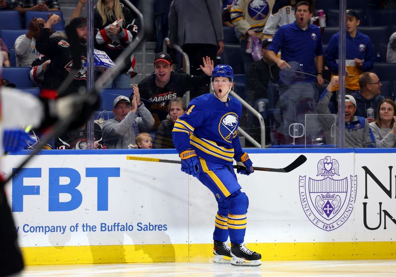 Nov 5, 2024; Buffalo, New York, USA;  Buffalo Sabres defenseman Bowen Byram (4) reacts after scoring goal during the second period against the Ottawa Senators at KeyBank Center. Mandatory Credit: Timothy T. Ludwig-Imagn Images