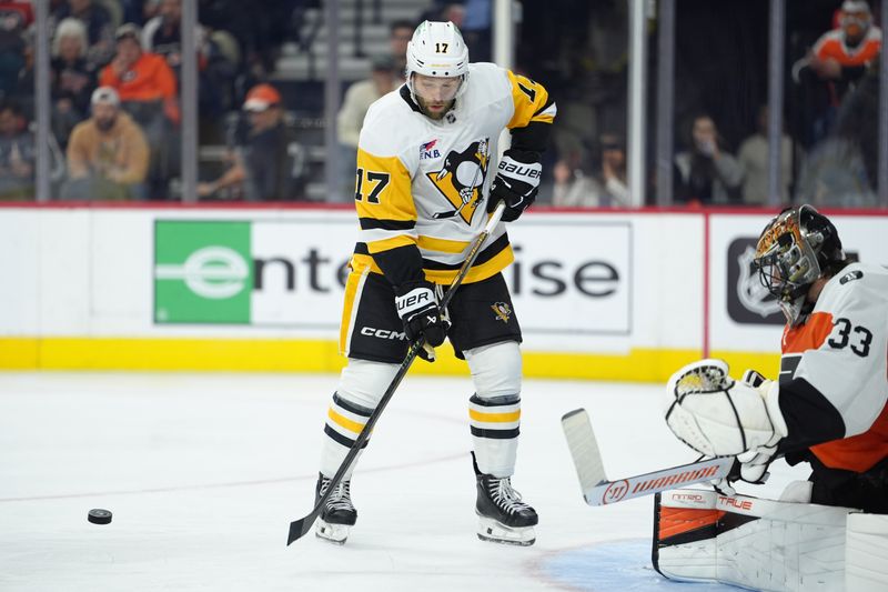 Oct 28, 2025; Philadelphia, Pennsylvania, USA; Pittsburgh Penguins right wing Bryan Rust (17) attempts to deflect a shot against the Philadelphia Flyers in the second period at Xfinity Mobile Arena. Mandatory Credit: Kyle Ross-Imagn Images