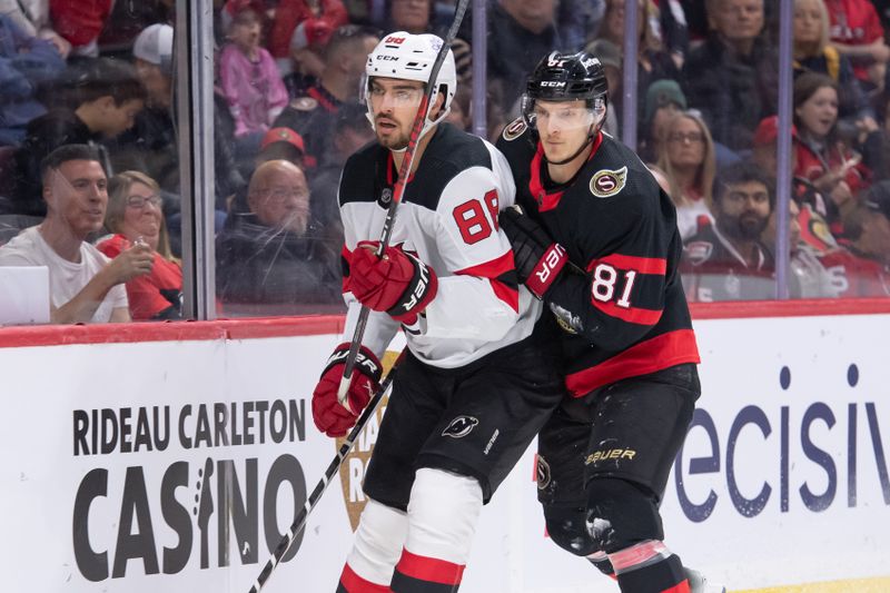 Apr 6, 2024; Ottawa, Ontario, CAN; New Jersey Devils defenseman Kevin Bahl (88) and Ottawa Senators left wing Dominik Kubalik (81) follow the puck in the first period at the Canadian Tire Centre. Mandatory Credit: Marc DesRosiers-USA TODAY Sports