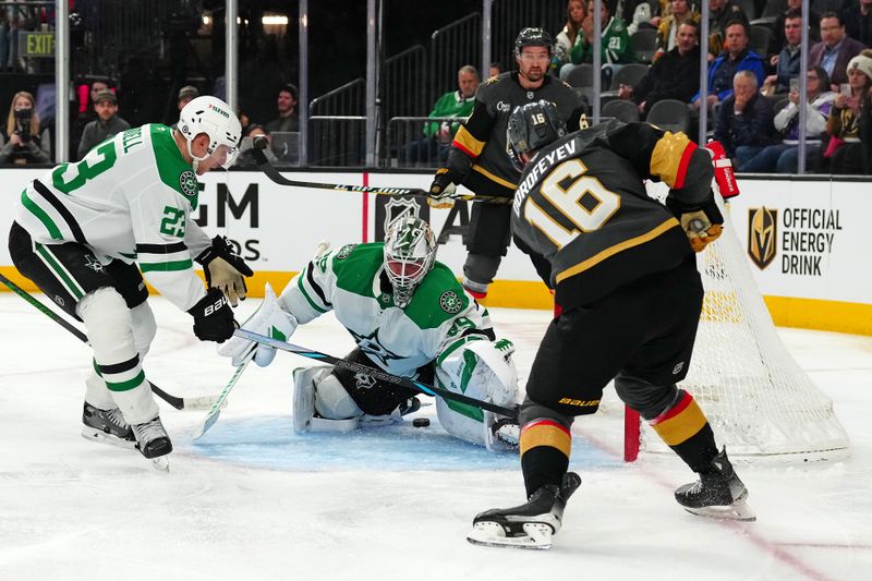 Jan 28, 2025; Las Vegas, Nevada, USA; Vegas Golden Knights left wing Pavel Dorofeyev (16) scores through the pads of Dallas Stars goaltender Jake Oettinger (29) during the second period at T-Mobile Arena. Mandatory Credit: Stephen R. Sylvanie-Imagn Images