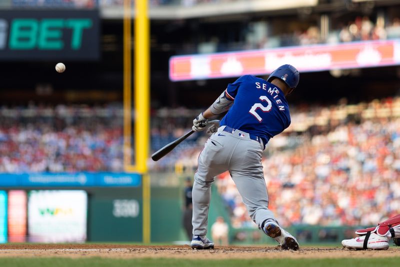 May 21, 2024; Philadelphia, Pennsylvania, USA; Texas Rangers second base Marcus Semien (2) hits an RBI double during the third inning against the Philadelphia Phillies at Citizens Bank Park. Mandatory Credit: Bill Streicher-USA TODAY Sports