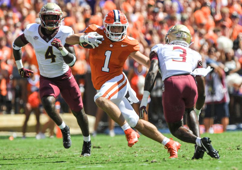 Sep 23, 2023; Clemson, South Carolina, USA; Clemson Tigers running back Will Shipley (1) runs against Florida State Seminoles defensive back Kevin Knowles II (3) during the first quarter at Memorial Stadium. Mandatory Credit: Ken Ruinard-USA TODAY Sports