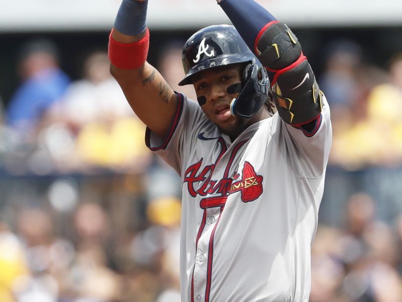 May 26, 2024; Pittsburgh, Pennsylvania, USA;  Atlanta Braves right fielder Ronald Acuña Jr. (13) reacts at second base with a double against the Pittsburgh Pirates during the first inning at PNC Park. Mandatory Credit: Charles LeClaire-USA TODAY Sports