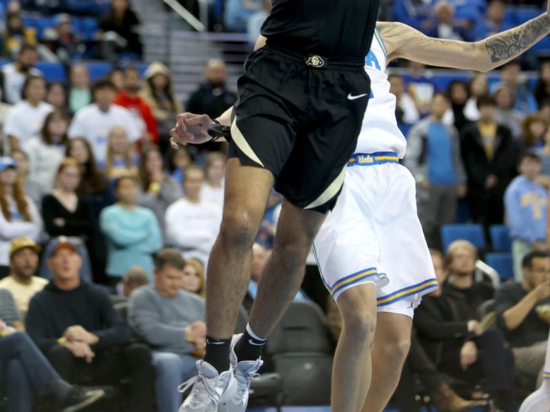 Jan 14, 2023; Los Angeles, California, USA;  Colorado Buffaloes guard Javon Ruffin (11) shoots the ball during the first half against the UCLA Bruins at Pauley Pavilion presented by Wescom. Mandatory Credit: Kiyoshi Mio-USA TODAY Sports