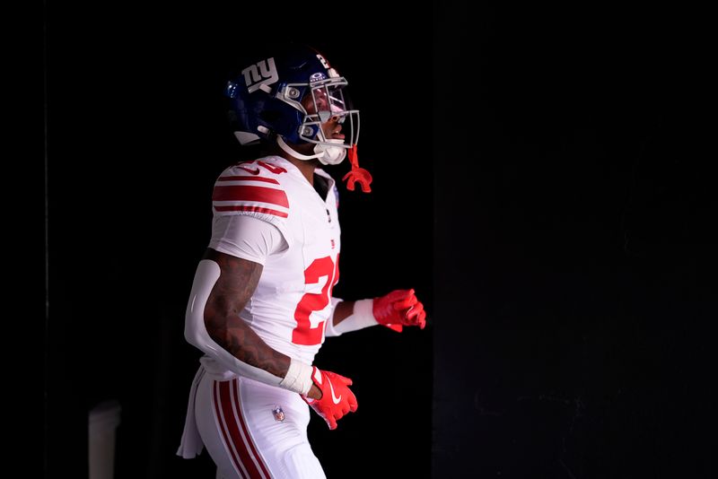 New York Giants running back Tyrone Tracy Jr. takes the field before an NFL football game against the Washington Commanders in Landover, N.C., Sunday, Sept. 15, 2024. (AP Photo/Matt Slocum)