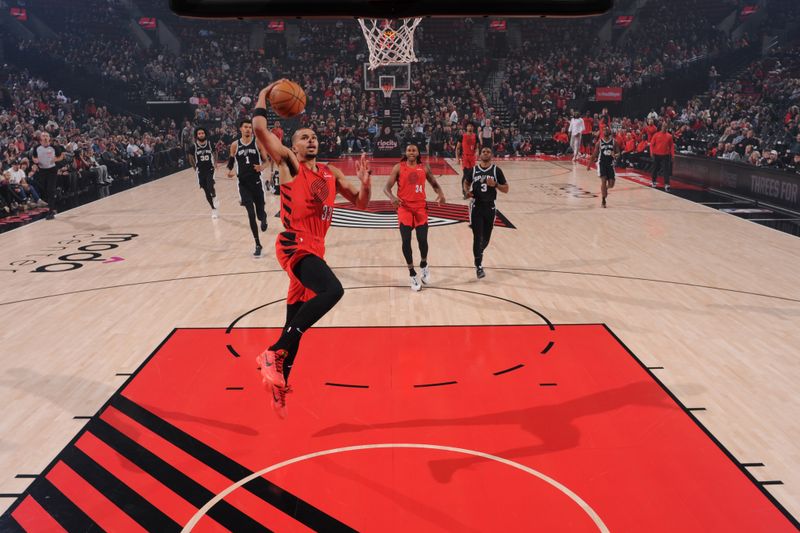 PORTLAND, OR - DECEMBER 13: Toumani Camara #33 of the Portland Trail Blazers drives to the basket during the game against the San Antonio Spurs on December 13, 2024 at the Moda Center Arena in Portland, Oregon. NOTE TO USER: User expressly acknowledges and agrees that, by downloading and or using this photograph, user is consenting to the terms and conditions of the Getty Images License Agreement. Mandatory Copyright Notice: Copyright 2024 NBAE (Photo by Cameron Browne/NBAE via Getty Images)