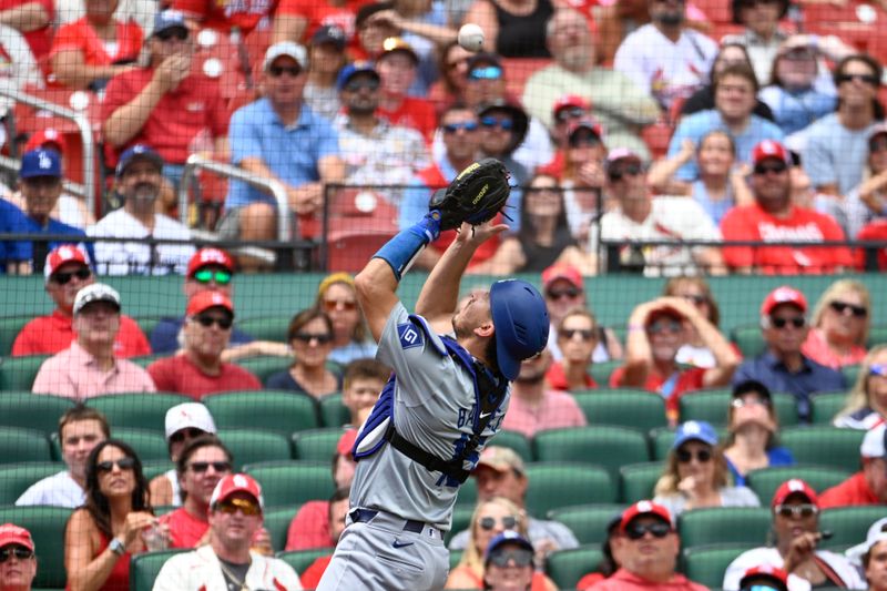 Aug 18, 2024; St. Louis, Missouri, USA; Los Angeles Dodgers catcher Austin Barnes (15) catches a foul ball hit by the St. Louis Cardinals in the third inning at Busch Stadium. Mandatory Credit: Joe Puetz-USA TODAY Sports