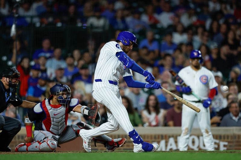 Sep 19, 2024; Chicago, Illinois, USA; Chicago Cubs shortstop Dansby Swanson (7) singles against the Washington Nationals during the seventh inning at Wrigley Field. Mandatory Credit: Kamil Krzaczynski-Imagn Images