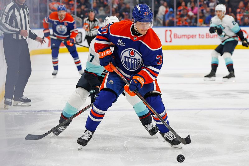 Sep 24, 2025; Edmonton, Alberta, CAN; Edmonton Oilers defensemen Atro Leppanen (37) protects the puck from Seattle Kraken forward Jordan Eberle (7) during the second period at Rogers Place. Mandatory Credit: Perry Nelson-Imagn Images