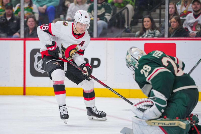 Apr 2, 2024; Saint Paul, Minnesota, USA; Ottawa Senators center Tim Stutzle (18) shoots against the Minnesota Wild goaltender Marc-Andre Fleury (29) in the third period at Xcel Energy Center. Mandatory Credit: Brad Rempel-USA TODAY Sports