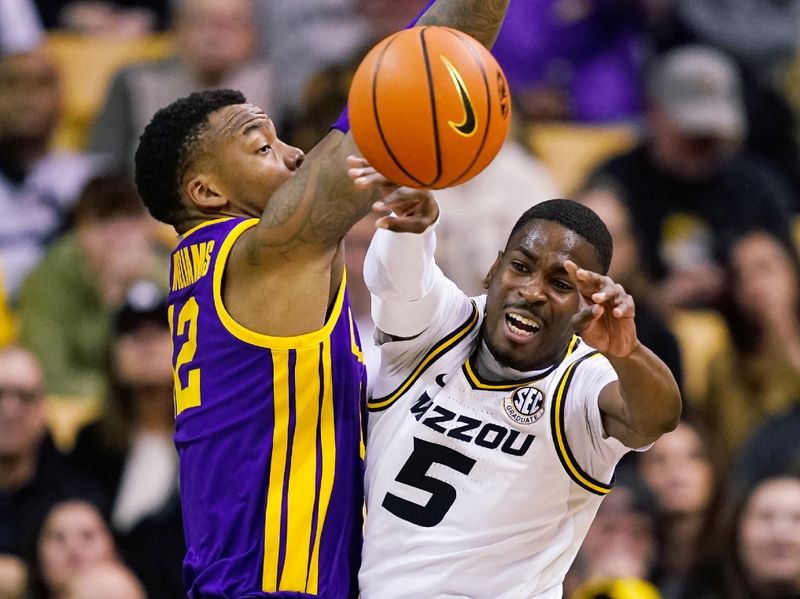 Feb 1, 2023; Columbia, Missouri, USA; Missouri Tigers guard D'Moi Hodge (5) passes the ball as LSU Tigers forward KJ Williams (12) defends during the second half at Mizzou Arena. Mandatory Credit: Jay Biggerstaff-USA TODAY Sports