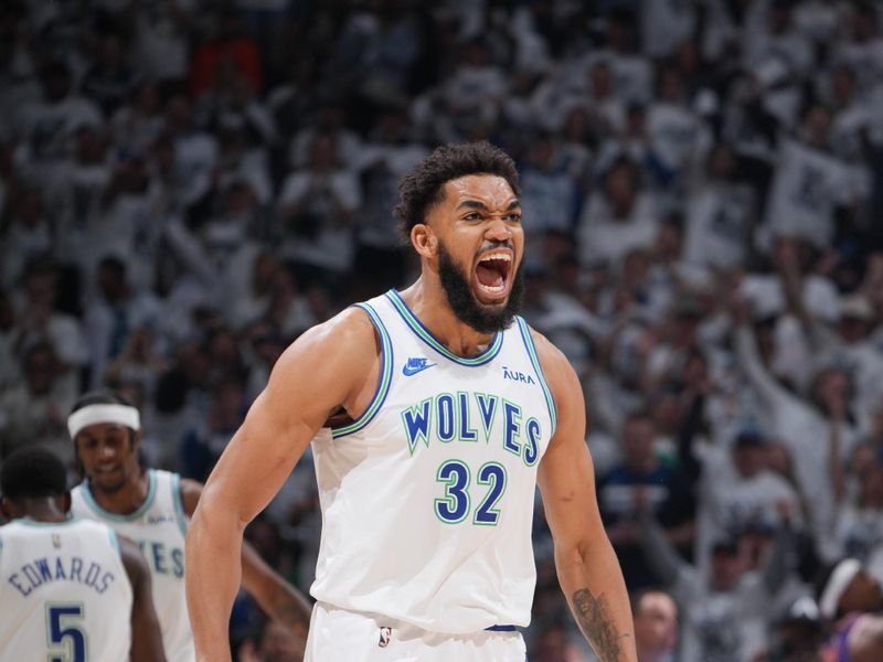 MINNEAPOLIS, MN -  APRIL 23: Karl-Anthony Towns #32 of the Minnesota Timberwolves celebrates during the game against the Phoenix Suns during Round One Game Two of the 2024 NBA Playoffs on April 23, 2024 at Target Center in Minneapolis, Minnesota. NOTE TO USER: User expressly acknowledges and agrees that, by downloading and or using this Photograph, user is consenting to the terms and conditions of the Getty Images License Agreement. Mandatory Copyright Notice: Copyright 2024 NBAE (Photo by Jordan Johnson/NBAE via Getty Images)