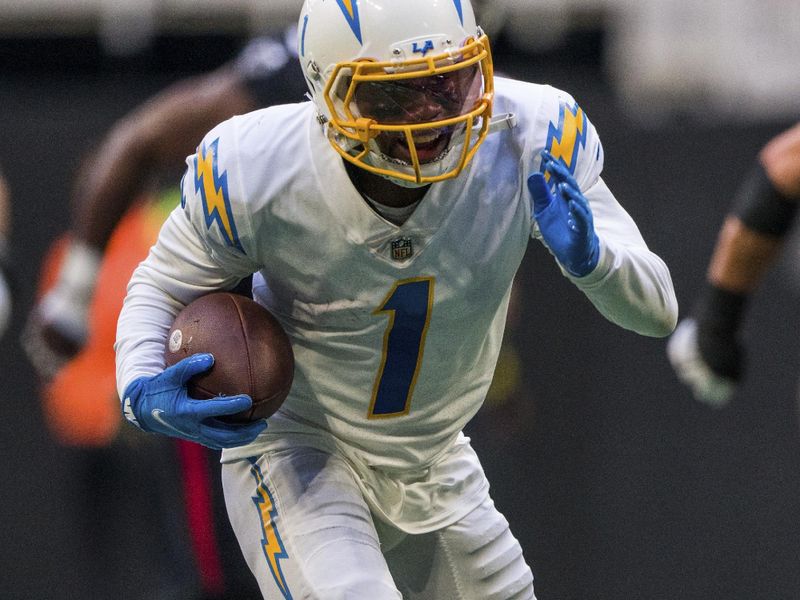 Los Angeles Chargers wide receiver DeAndre Carter (1) runs the ball during the first half of an NFL football game against the Atlanta Falcons, Sunday, Nov. 6, 2022, in Atlanta. The Los Angeles Chargers won 20-17. (AP Photo/Danny Karnik)