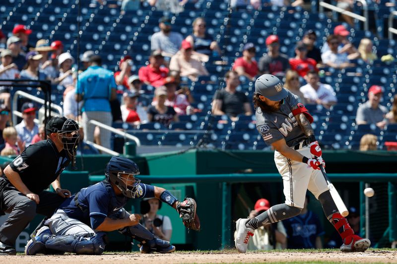 Apr 5, 2023; Washington, District of Columbia, USA; Washington Nationals first baseman Michael Chavis (6) hits an RBI single against the Tampa Bay Rays during the third inning at Nationals Park. Mandatory Credit: Geoff Burke-USA TODAY Sports