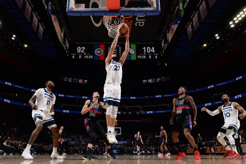 DETROIT, MI - JANUARY 17: Rudy Gobert #27 of the Minnesota Timberwolves grabs a rebound during the game against the Detroit Pistons on January 17, 2024 at Little Caesars Arena in Detroit, Michigan. NOTE TO USER: User expressly acknowledges and agrees that, by downloading and/or using this photograph, User is consenting to the terms and conditions of the Getty Images License Agreement. Mandatory Copyright Notice: Copyright 2024 NBAE (Photo by Chris Schwegler/NBAE via Getty Images)