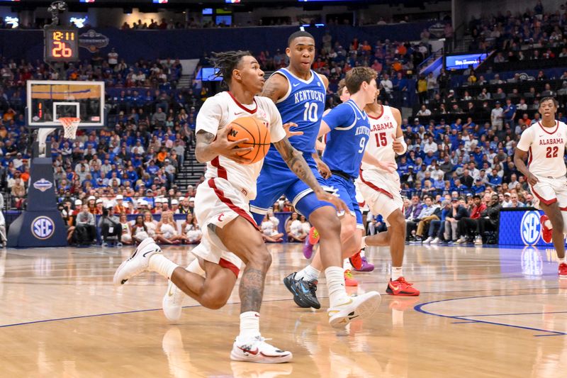 Mar 14, 2025; Nashville, TN, USA;  Alabama Crimson Tide0 drives to the basket against the Kentucky Wildcats during the first half at Bridgestone Arena. Mandatory Credit: Steve Roberts-Imagn Images