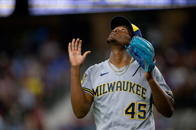 Aug 18, 2023; Arlington, Texas, USA; Milwaukee Brewers relief pitcher Abner Uribe (45) walks off the field after he pitches against the Texas Rangers during the sixth inning at Globe Life Field. Mandatory Credit: Jerome Miron-USA TODAY Sports