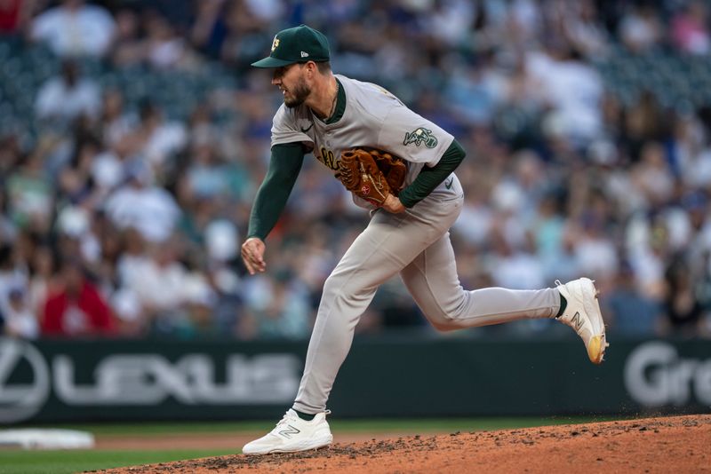 May 11, 2024; Seattle, Washington, USA; Oakland Athletics reliever Mitch Spence (40) delivers a pitch during the sixth inning against the Seattle Mariners at T-Mobile Park. Mandatory Credit: Stephen Brashear-USA TODAY Sports