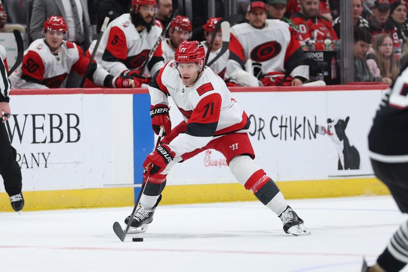 Jan 17, 2026; Newark, New Jersey, USA; Carolina Hurricanes left wing Taylor Hall (71) skates with the puck against the New Jersey Devils during the first period at Prudential Center. Mandatory Credit: Thomas Salus-Imagn Images