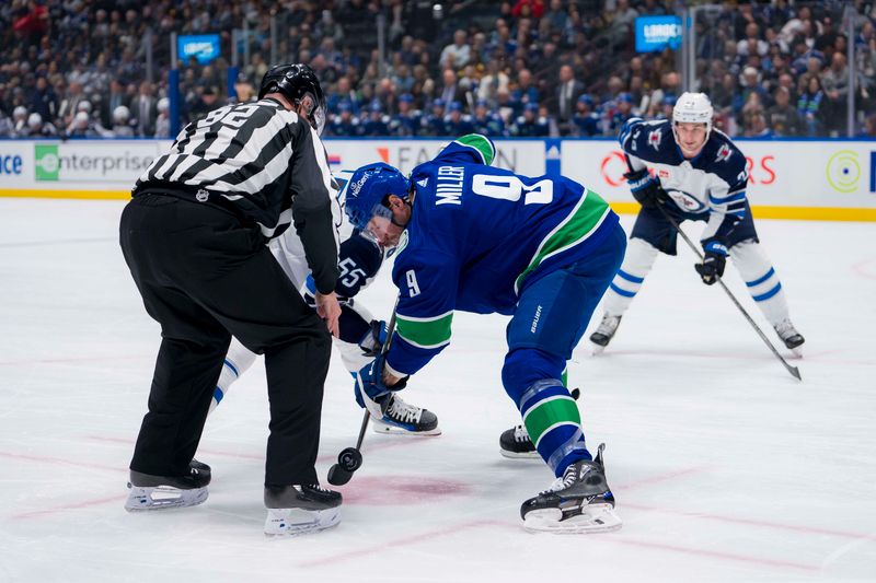 Feb 17, 2024; Vancouver, British Columbia, CAN; Vancouver Canucks forward J.T. Miller (9) wins a faceoff draw against Winnipeg Jets forward Mark Scheifele (55) in the first period at Rogers Arena. Mandatory Credit: Bob Frid-USA TODAY Sports