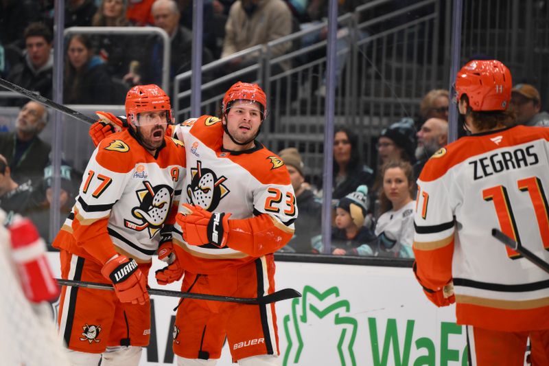 Nov 27, 2024; Seattle, Washington, USA; The Anaheim Ducks celebrate after a goal scored by left wing Alex Killorn (17) during the second period against the Seattle Kraken at Climate Pledge Arena. Mandatory Credit: Steven Bisig-Imagn Images