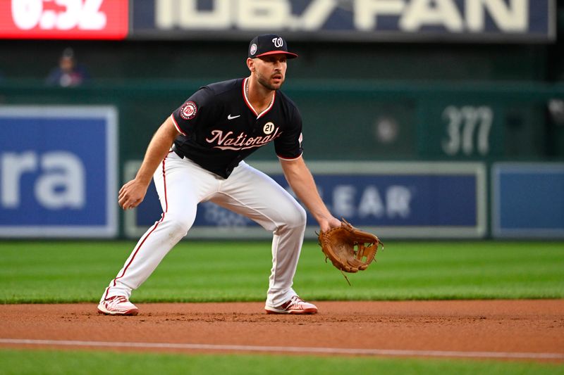 Sep 15, 2025; Washington, District of Columbia, USA; Washington Nationals third baseman Paul DeJong (14) in the field against the Atlanta Braves during the first inning at Nationals Park. Mandatory Credit: Brad Mills-Imagn Images