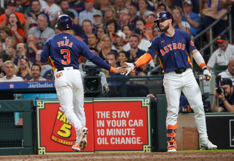 May 15, 2024; Houston, Texas, USA; Houston Astros left fielder Trey Cabbage (38) celebrates shortstop Jeremy Pena (3) run against the Oakland Athletics in the fourth inning at Minute Maid Park. Mandatory Credit: Thomas Shea-USA TODAY Sports