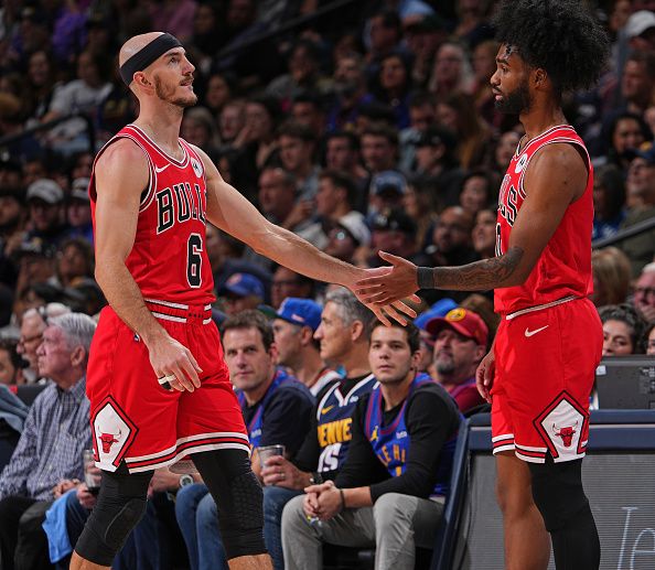 DENVER, CO - NOVEMBER 4: Alex Caruso #6 and Coby White #0 of the Chicago Bulls high five during the game against the Denver Nuggets on November 4, 2023 at the Ball Arena in Denver, Colorado. NOTE TO USER: User expressly acknowledges and agrees that, by downloading and/or using this Photograph, user is consenting to the terms and conditions of the Getty Images License Agreement. Mandatory Copyright Notice: Copyright 2023 NBAE (Photo by Bart Young/NBAE via Getty Images)