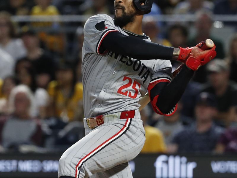 Jun 7, 2024; Pittsburgh, Pennsylvania, USA;  Minnesota Twins center fielder Byron Buxton (25) hits a single against the Pittsburgh Pirates during the ninth inning at PNC Park. The Pirates shutout the Twins 3-0. Mandatory Credit: Charles LeClaire-USA TODAY Sports
