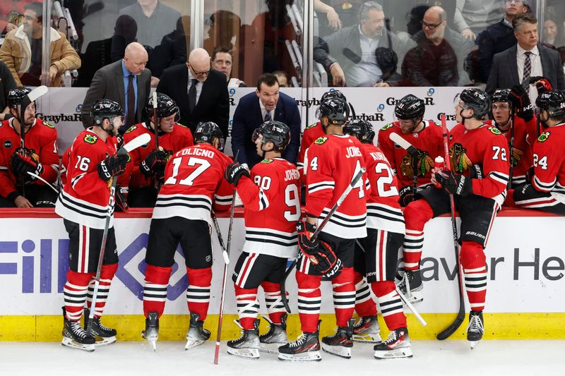 Feb 7, 2024; Chicago, Illinois, USA; Chicago Blackhawks head coach Luke Richardson talks to his players during the third period at United Center. Mandatory Credit: Kamil Krzaczynski-USA TODAY Sports