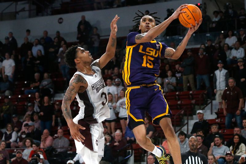 Feb 8, 2023; Starkville, Mississippi, USA; LSU Tigers forward Tyrell Ward (15) drives to the basket as Mississippi State Bulldogs guard Shakeel Moore (3) defends during the second half at Humphrey Coliseum. Mandatory Credit: Petre Thomas-USA TODAY Sports