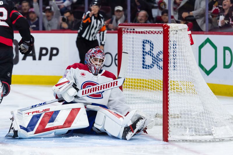 Apr 11, 2025; Ottawa, Ontario, CAN; Montreal Canadiens  goalie Sam Montembeault (35) is unable to stop a shot on goal in the first period against the Ottawa Senators at the Canadian Tire Centre. Mandatory Credit: Marc DesRosiers-Imagn Images