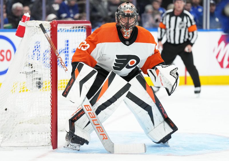 Feb 15, 2024; Toronto, Ontario, CAN; Philadelphia Flyers goaltender Samuel Ersson (33) follows the play against the Toronto Maple Leafs during the first period at Scotiabank Arena. Mandatory Credit: Nick Turchiaro-USA TODAY Sports