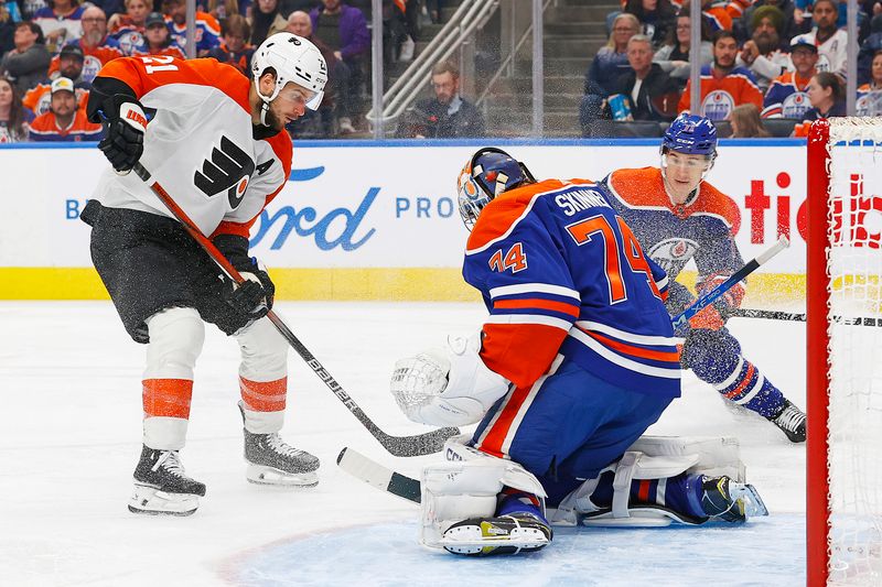 Jan 2, 2024; Edmonton, Alberta, CAN; Edmonton Oilers goaltender Stuart Skinner (74) makes a save on Philadelphia Flyers forward Scott Laughton (21) during the second period at Rogers Place. Mandatory Credit: Perry Nelson-USA TODAY Sports